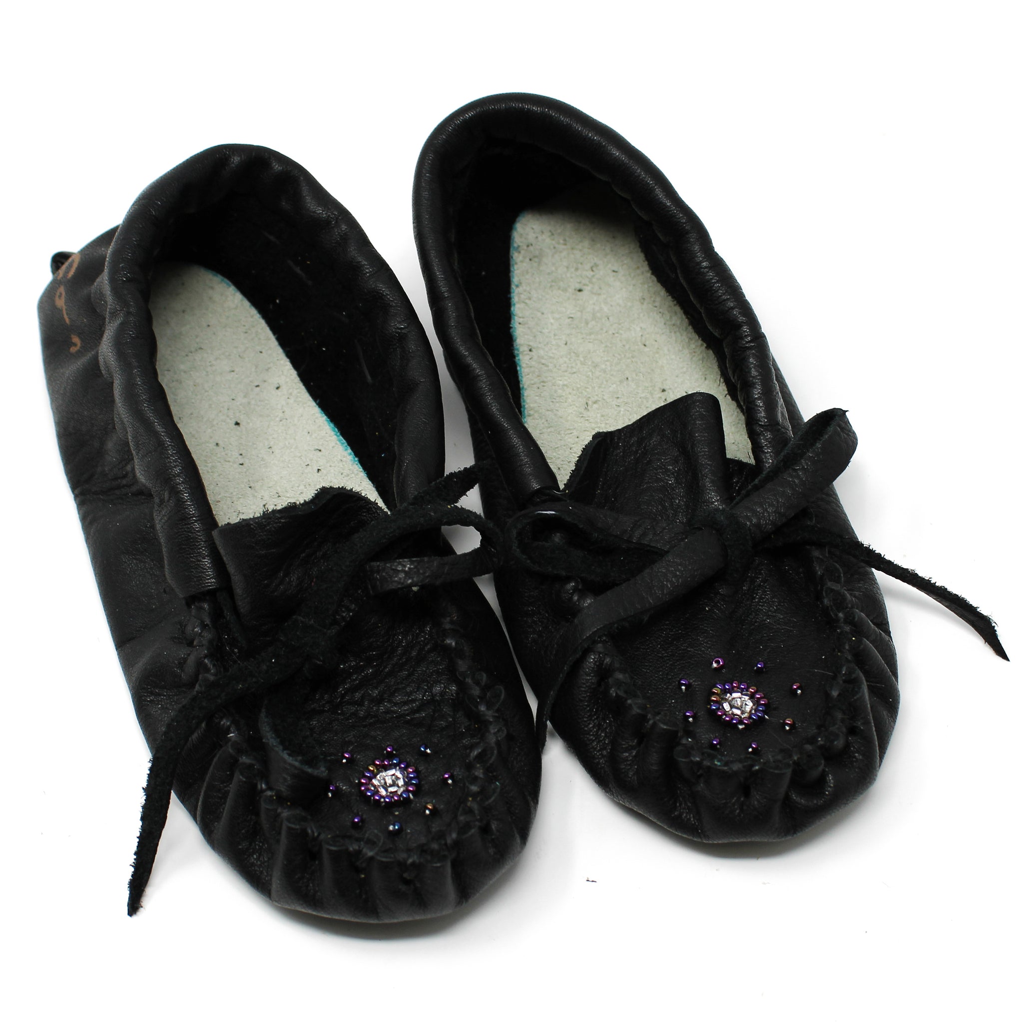 Black leather beadwork slippers